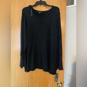 Black sparkly sweater with bell sleeves on the bottom and tie detailing.